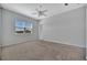 Bright bedroom with large window overlooking a serene pond view and a ceiling fan at 3838 Manorwood Loop, Parrish, FL 34219