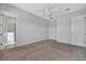 Spacious bedroom with neutral carpet, ceiling fan, and ensuite bathroom access at 3838 Manorwood Loop, Parrish, FL 34219