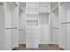 Walk-in closet featuring custom shelving and drawer organization for efficient storage at 3838 Manorwood Loop, Parrish, FL 34219