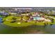 Aerial view of the community pool, tennis courts, playground, and clubhouse at 3838 Manorwood Loop, Parrish, FL 34219