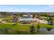 Aerial view of the community pool, playground, and clubhouse at 3838 Manorwood Loop, Parrish, FL 34219