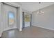 Inviting dining area with elegant chandelier, natural light, and access to outdoor space at 3838 Manorwood Loop, Parrish, FL 34219