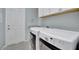 Laundry room featuring washer, dryer, sink, and storage at 3838 Manorwood Loop, Parrish, FL 34219