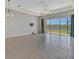 Open living space with sliding glass doors to the screened patio and views of the water at 3838 Manorwood Loop, Parrish, FL 34219