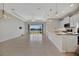 Bright open-concept living area with large windows overlooking a scenic waterfront view at 3838 Manorwood Loop, Parrish, FL 34219