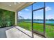 Screened-in patio provides clear view of the pool, lake, and neighborhood at 3838 Manorwood Loop, Parrish, FL 34219