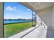 Screened-in patio provides clear view of the lake and the neighborhood at 3838 Manorwood Loop, Parrish, FL 34219