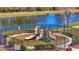 Community playground with slides and climbing structures situated near a tranquil lake at 3838 Manorwood Loop, Parrish, FL 34219