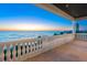 Balcony offering stunning ocean views, complete with classic white railings and ample space at 3909 Casey Key Rd, Nokomis, FL 34275