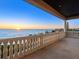 Balcony overlooking the ocean with decorative balusters and an amazing view of the sunrise at 3909 Casey Key Rd, Nokomis, FL 34275