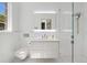 Bright bathroom featuring a modern vanity with illuminated mirror and walk-in shower with rainfall showerhead at 3909 Casey Key Rd, Nokomis, FL 34275