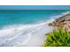 Picturesque beach with turquoise water and sandy shore, showcasing natural beauty at 3909 Casey Key Rd, Nokomis, FL 34275