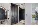 A modern elevator inside the home, offering easy access between floors with elegant wood doors at 3909 Casey Key Rd, Nokomis, FL 34275