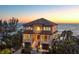 Stunning beachfront home featuring balconies and a private entrance, offering breathtaking ocean views at 3909 Casey Key Rd, Nokomis, FL 34275