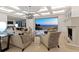 Bright living room with modern furniture, fireplace, and sliding glass doors leading to ocean views at 3909 Casey Key Rd, Nokomis, FL 34275
