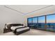 Bright main bedroom with sliding glass doors, ocean view, and modern design at 3909 Casey Key Rd, Nokomis, FL 34275