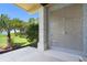 Outdoor shower with tiled wall, with tropical plants nearby and ocean in the background at 3909 Casey Key Rd, Nokomis, FL 34275