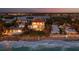 A three-story waterfront home, situated directly on the beach, with a private access point to the shore at 3909 Casey Key Rd, Nokomis, FL 34275
