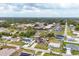 Suburban home with a school in the background, showing the location's proximity to community resources at 392 Yeager St, Port Charlotte, FL 33954