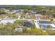 Aerial view of a neighborhood with houses and backyard swimming pools at 392 Yeager St, Port Charlotte, FL 33954