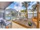 Backyard featuring a private pool, wooden deck, and plenty of seating at 392 Yeager St, Port Charlotte, FL 33954
