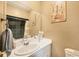 Bathroom featuring modern sink and vanity with black tiled shower and bathtub combo at 392 Yeager St, Port Charlotte, FL 33954