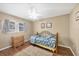 Serene bedroom with hardwood floors, soft lighting, and a view of the window at 392 Yeager St, Port Charlotte, FL 33954