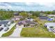 Charming single-story home featuring a well-manicured lawn and solar panels on the roof at 392 Yeager St, Port Charlotte, FL 33954