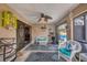 Inviting Florida room with a cozy seating area that offers an exterior view of the pool at 392 Yeager St, Port Charlotte, FL 33954
