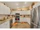 Modern kitchen with white cabinets, stainless steel appliances, and stylish countertops at 392 Yeager St, Port Charlotte, FL 33954