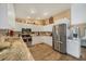 Well-lit kitchen featuring stainless steel appliances and ample white cabinetry at 392 Yeager St, Port Charlotte, FL 33954