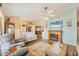 Inviting living room with a fireplace, ceiling fan, and hardwood flooring at 392 Yeager St, Port Charlotte, FL 33954