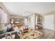 Inviting living room featuring wood floors, ceiling fan, and entertainment center at 392 Yeager St, Port Charlotte, FL 33954