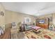 Relaxing living room featuring wood floors, ceiling fan, and tasteful decorations at 392 Yeager St, Port Charlotte, FL 33954
