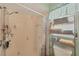 Tiled shower stall featuring neutral tiles, a shower caddy, and a hand-held shower head at 392 Yeager St, Port Charlotte, FL 33954