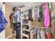 Functional walk-in closet featuring extensive shelving and hanging space for optimal storage at 392 Yeager St, Port Charlotte, FL 33954