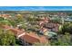 An aerial view shows the beautiful community with a pool, landscaping, and parking at 3958 Mediterranea Cir # 411, Sarasota, FL 34233