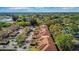 Aerial view of townhomes with beautiful landscaping and ample parking space at 3958 Mediterranea Cir # 411, Sarasota, FL 34233