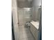 Bathroom featuring tile flooring, a white vanity, and a glass-enclosed shower at 3958 Mediterranea Cir # 411, Sarasota, FL 34233