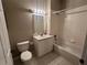A full bathroom features tile floors, vanity, mirror and a bathtub with shower at 3958 Mediterranea Cir # 411, Sarasota, FL 34233