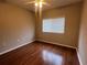 Bedroom featuring hardwood floors and a bright window at 3958 Mediterranea Cir # 411, Sarasota, FL 34233