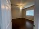 Bedroom with hardwood floors, ceiling fan, and natural light at 3958 Mediterranea Cir # 411, Sarasota, FL 34233