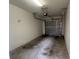 Clean garage interior with white walls and overhead lighting at 3958 Mediterranea Cir # 411, Sarasota, FL 34233