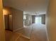 A spacious living room boasts neutral tones and sliding doors to the lanai at 3958 Mediterranea Cir # 411, Sarasota, FL 34233