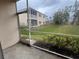 View from screened-in patio to green lawn at 3958 Mediterranea Cir # 411, Sarasota, FL 34233