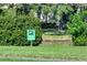 Charming community Crane Lake offers scenic views and abundant nature, marked by a sign among lush greenery at 4141 Entrada Ct, Sarasota, FL 34238