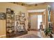 Elegant foyer featuring hardwood floors, high ceilings, and decoratively adorned with art and sculptures at 4141 Entrada Ct, Sarasota, FL 34238