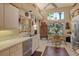 Well-lit kitchen with a window over the sink and a dining nook with a view at 4141 Entrada Ct, Sarasota, FL 34238