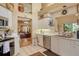 Bright kitchen with stainless appliances, white cabinets, and views to the living area at 4141 Entrada Ct, Sarasota, FL 34238