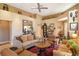 Open-concept living room with hardwood floors, neutral walls, comfortable seating, and natural light at 4141 Entrada Ct, Sarasota, FL 34238